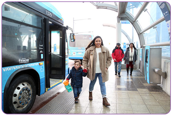 Image of mother and son leaving bus