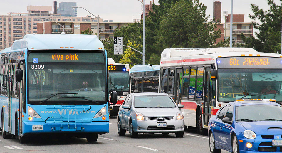 buses and cars in heavy traffic